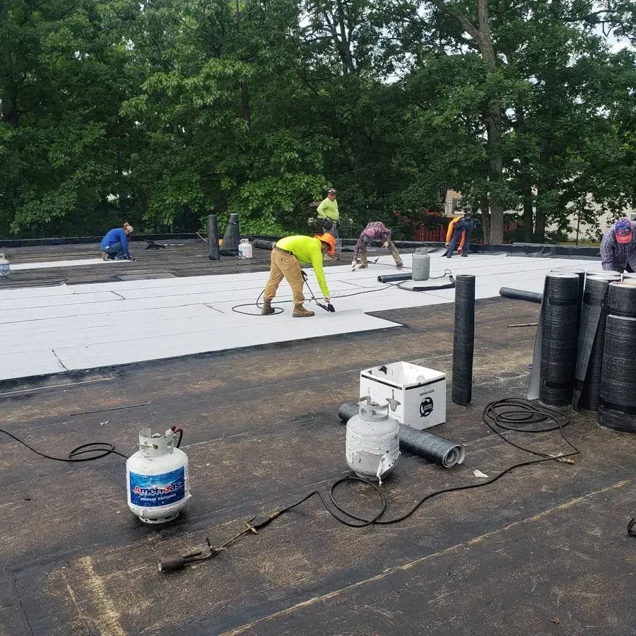 Roofers installing a new flat roof