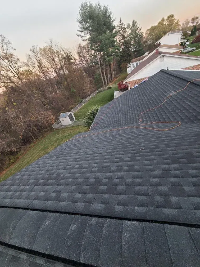Finished dark shingle roof after installation